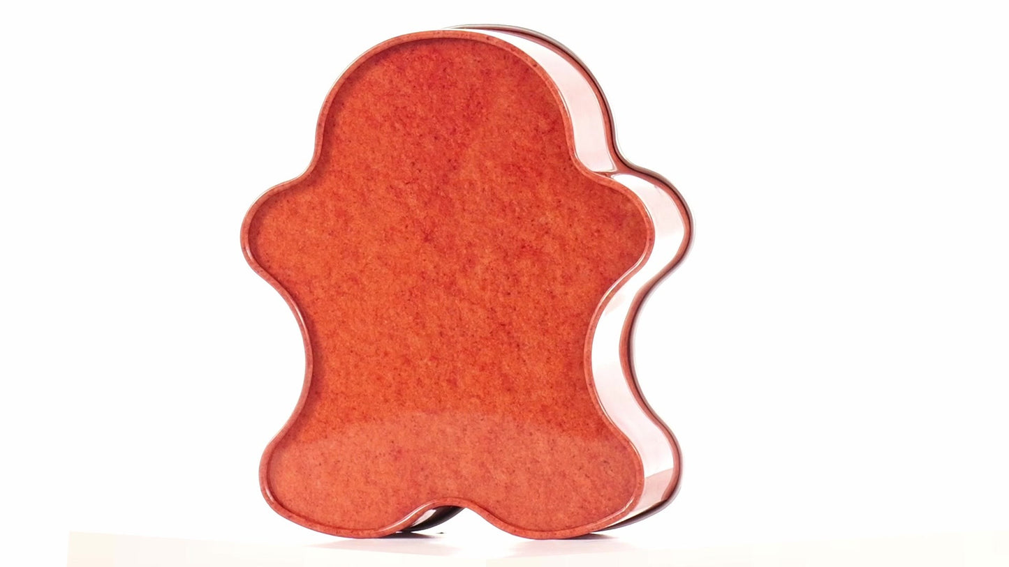 Metal box in the shape of a gingerbread man