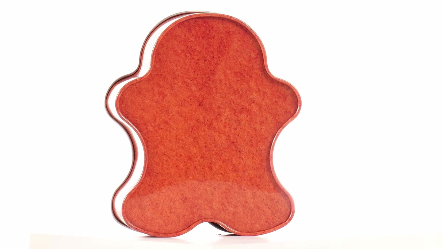 Metal box in the shape of a gingerbread man