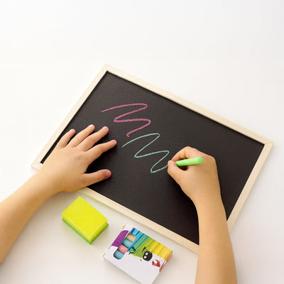 Drawing board with colored chalk and sponge